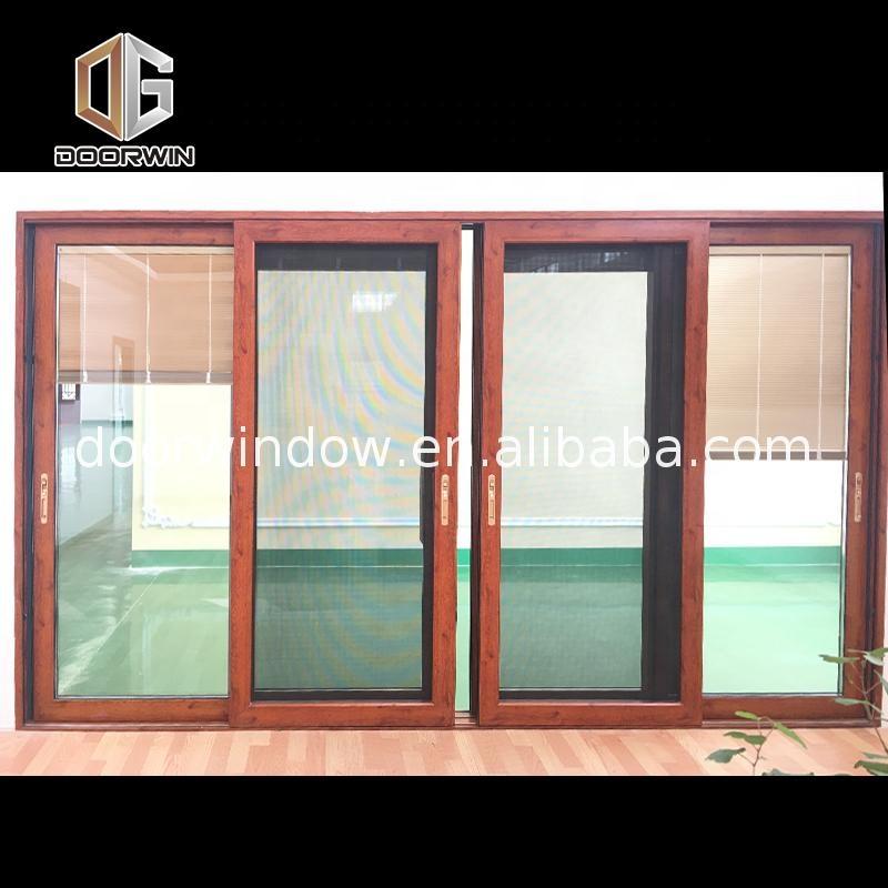 Doorwin 2021-Aluminum hanging sliding glass interior and exterior door designs by Doorwin on Alibaba