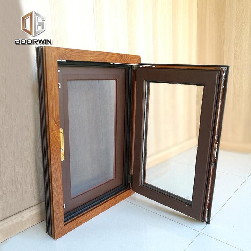 DOORWIN 2021Las Vegas hot sale wood grain tempered glass aluminium tilt up window with built in screens