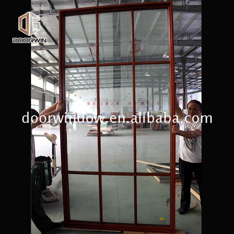 Doorwin 2021-American building code aluminum wood frame glass doors and crank out windows by Doorwin on Alibaba