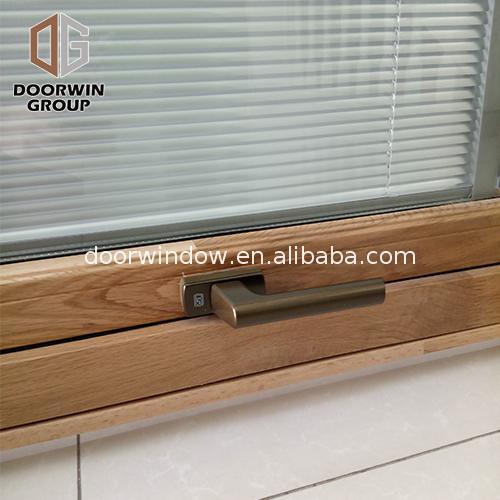 Doorwin 2021China Factory Seller aluminum awning window with wood frame manufacturers alloy top hung windows