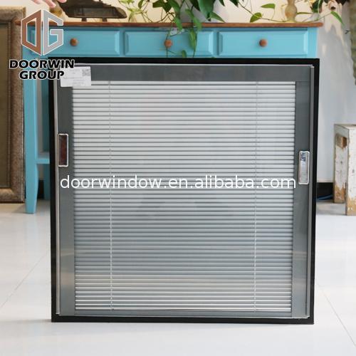 Doorwin 2021China Factory Seller aluminum awning window with wood frame manufacturers alloy top hung windows