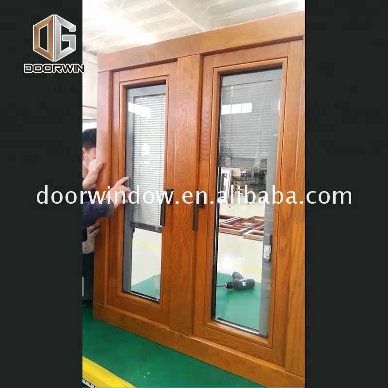 DOORWIN 2021Double glazed aluminium wood composite door and windows frame decorative aluminum cladding doors by Doorwin on Alibaba