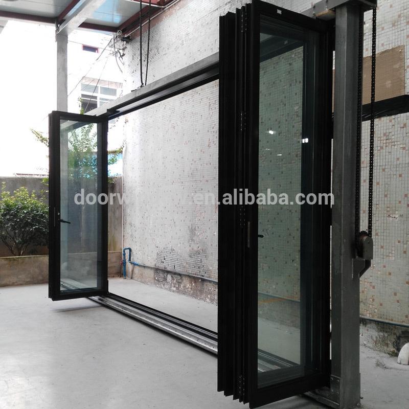 DOORWIN 2021Folding patio doors cost popular aluminium bi fold windows and three panel door by Doorwin on Alibaba