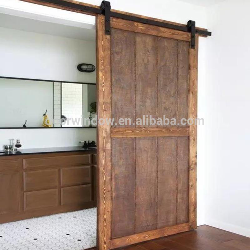 DOORWIN 2021Movable plank panel wooden doors design catalogue surface stained sliding barn door for partition by Doorwin