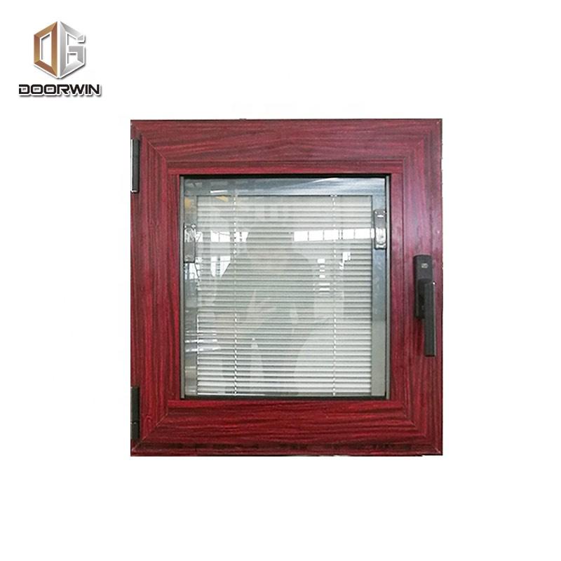 DOORWIN 2021New York wood grain tempered glass aluminium tilt and turn window with built in shuttersby Doorwin