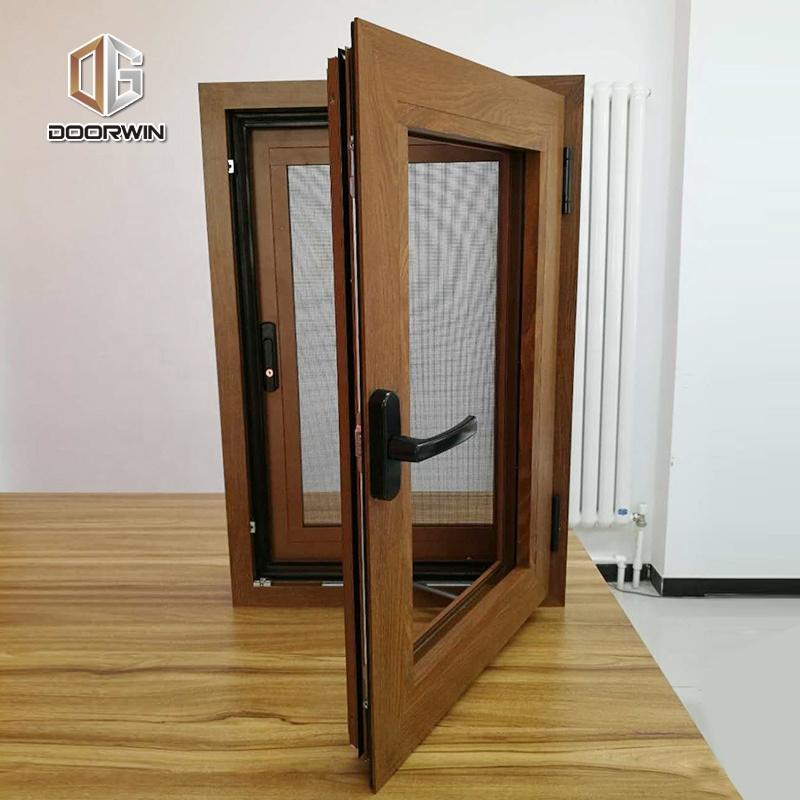 DOORWIN 2021Princeton hot sale wood grain tempered glass aluminium tilt & turn window with built in shuttersby Doorwin