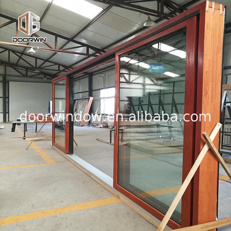 DOORWIN 2021Sliding gate door wooden almirah designs wheels by Doorwin on Alibaba