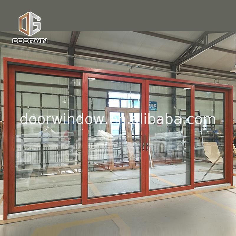 DOORWIN 2021Used commercial glass doors teak wood front door design swing by Doorwin on Alibaba